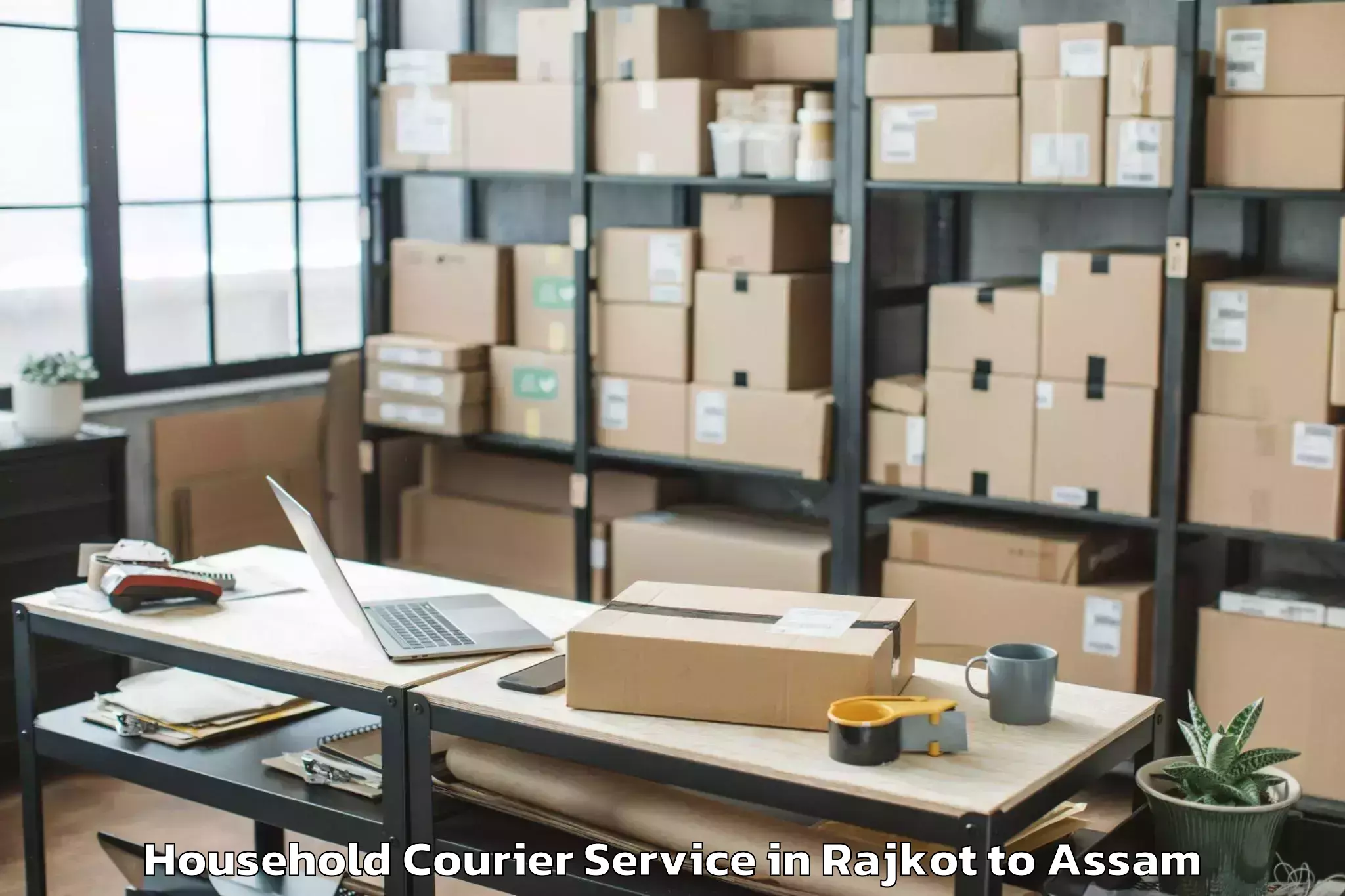 Book Rajkot to Muhimari Bilar Pathar Household Courier